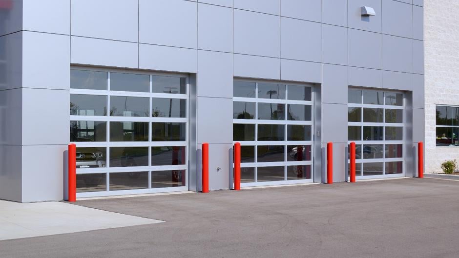 Commercial glass garage doors with white frame