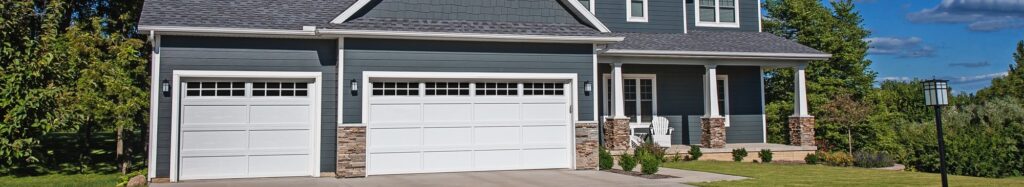 White traditional garage doors with an overlay